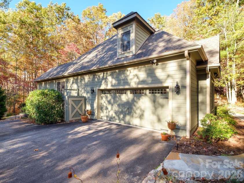 674 Soquili Drive, Brevard, NC 28712.  MLS# CAR4352829, YatesRealty ID 15540. Side 2 car Garage