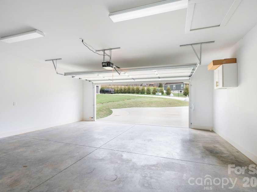 311 Hookers Gap Road, Candler, NC 28715.  MLS# CAR4358991, YatesRealty ID 15544. Attached Two-Car Garage