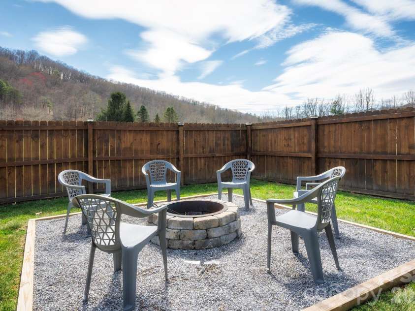 311 Hookers Gap Road, Candler, NC 28715.  MLS# CAR4358991, YatesRealty ID 15544. Fire Pit for Chilly Evenings