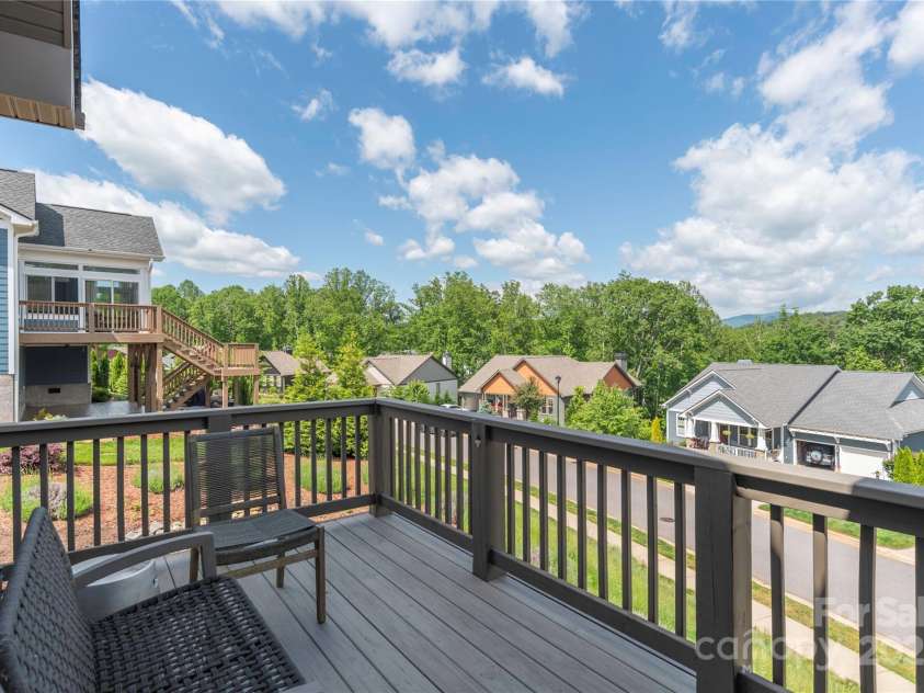 5 Buckhorn Gap Road, Biltmore Lake, NC 28715.  MLS# CAR4261479, YatesRealty ID 15544. Covered back porch connects to this open porch