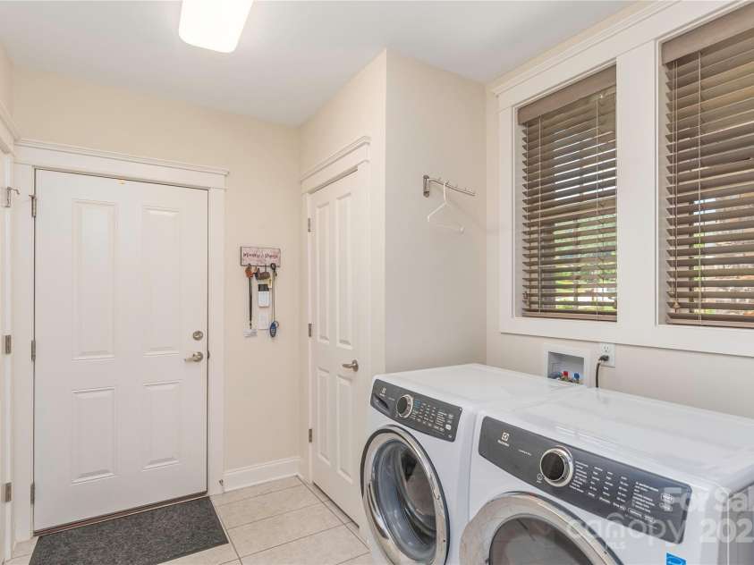 5 Buckhorn Gap Road, Biltmore Lake, NC 28715.  MLS# CAR4261479, YatesRealty ID 15544. Mudroom off of garage with storage, closets and laundry