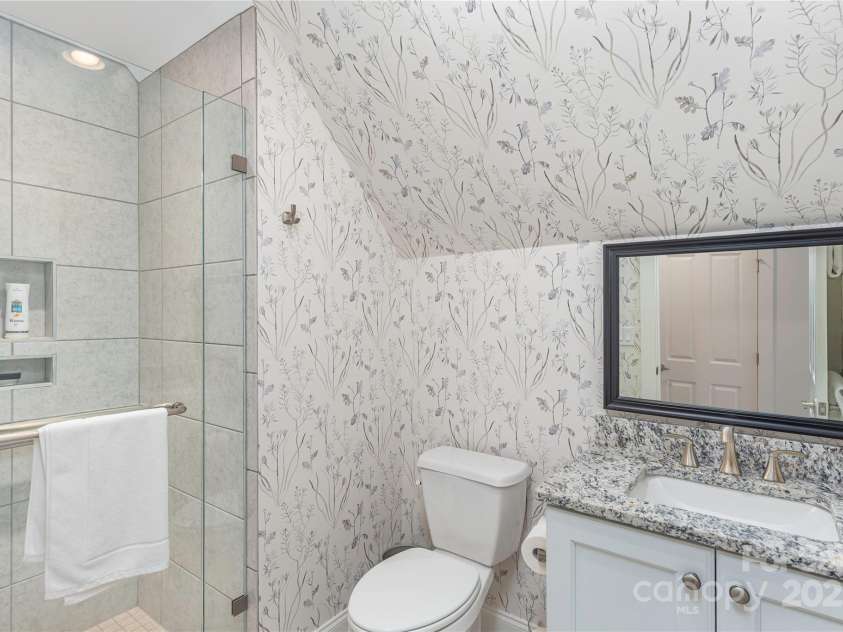 5 Buckhorn Gap Road, Biltmore Lake, NC 28715.  MLS# CAR4261479, YatesRealty ID 15544. Secondary bedroom suite with walk-in tiled shower