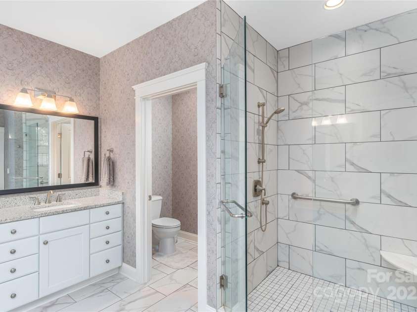 5 Buckhorn Gap Road, Biltmore Lake, NC 28715.  MLS# CAR4261479, YatesRealty ID 15544. Tiled, oversized walk-in shower