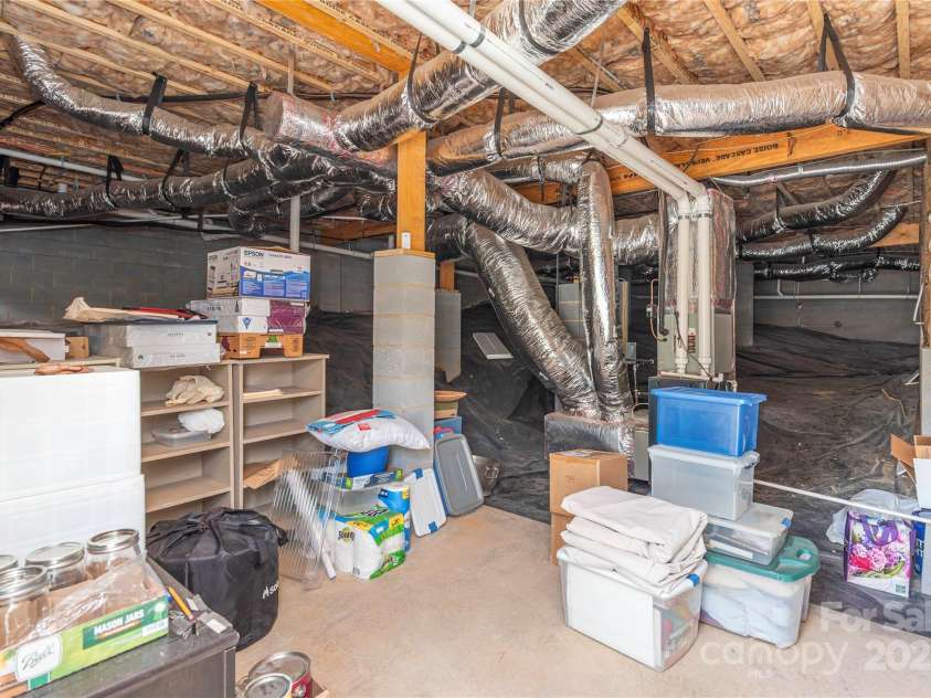 5 Buckhorn Gap Road, Biltmore Lake, NC 28715.  MLS# CAR4261479, YatesRealty ID 15544. Walk-in crawlspace with poured concrete floor for storage