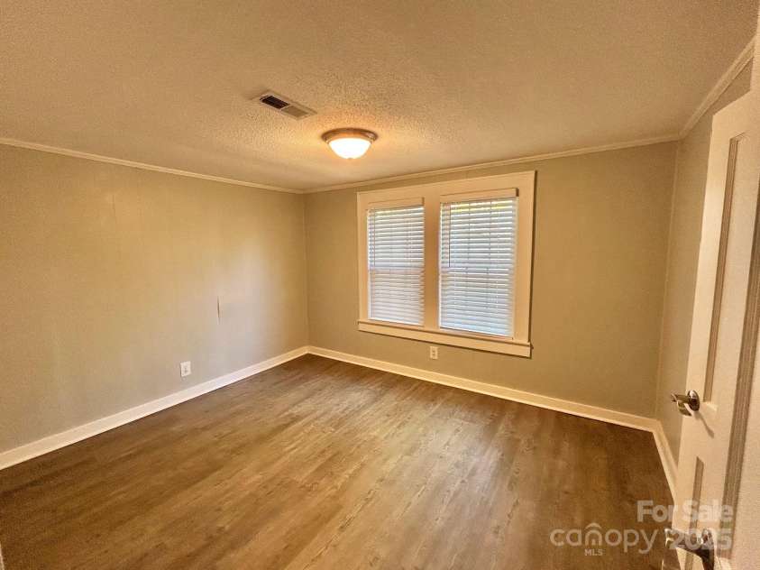 121 11th Street, Oakboro, NC 28129.  MLS# CAR4247731, YatesRealty ID 15547. Upstairs Bedroom