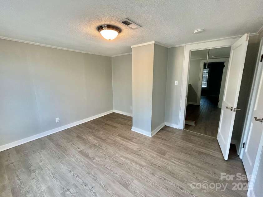 121 11th Street, Oakboro, NC 28129.  MLS# CAR4247731, YatesRealty ID 15547. Upstairs Bedroom