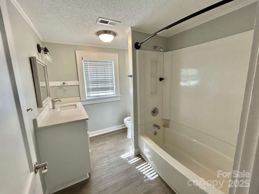 121 11th Street, Oakboro, NC 28129.  MLS# CAR4247731, YatesRealty ID 15547. Ustairs Bathroom