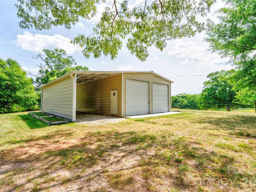 118 Crow Road, Shelby, NC 28152.  MLS# CAR4368353, YatesRealty ID 15549. Detached Double Garage with Lean-To
