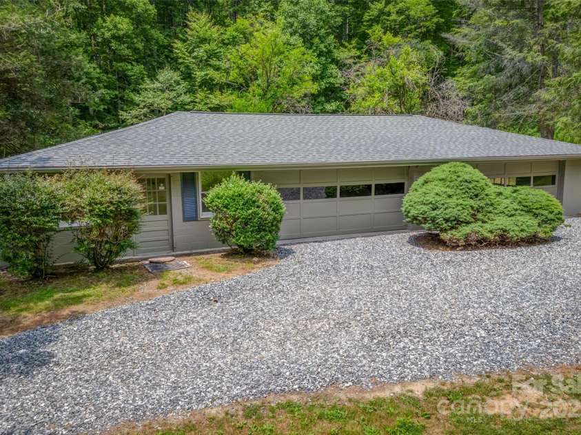 8749 Nc 63 Highway, Leicester, NC 28748.  MLS# CAR4214996, YatesRealty ID 1555. 4 car garage with 8749