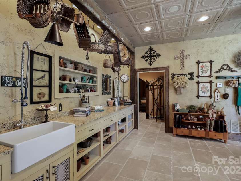 205 Indrio Road, Blowing Rock, NC 28605.  MLS# CAR4245602, YatesRealty ID 15556. A portion of the Lower Level Garden Room, leading to back stone patio and lower living areas