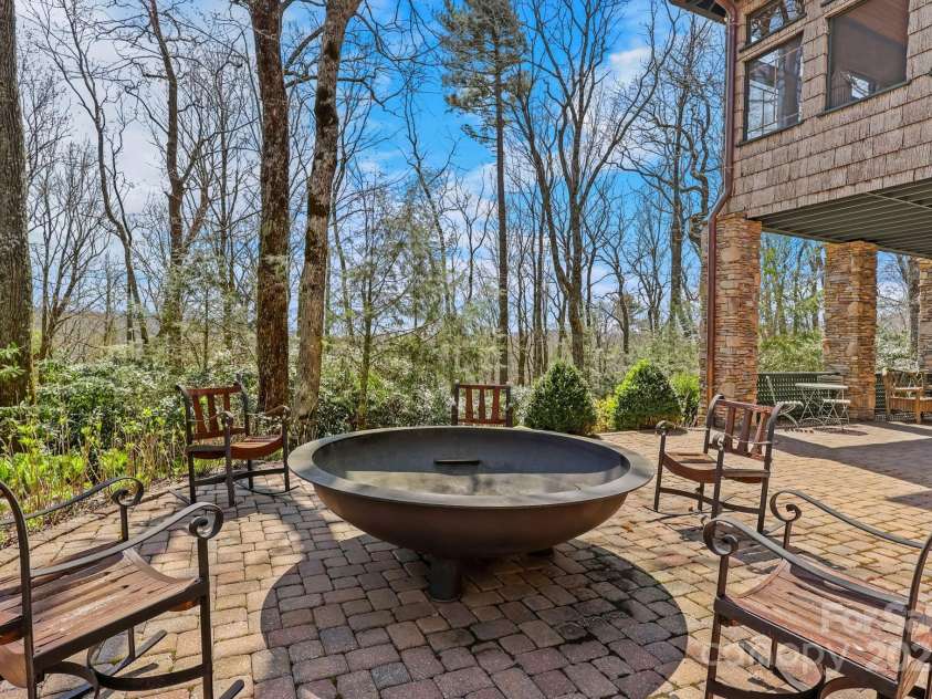 205 Indrio Road, Blowing Rock, NC 28605.  MLS# CAR4245602, YatesRealty ID 15556. Back Patio with Firepit, fashioned from the back of an oil truck!