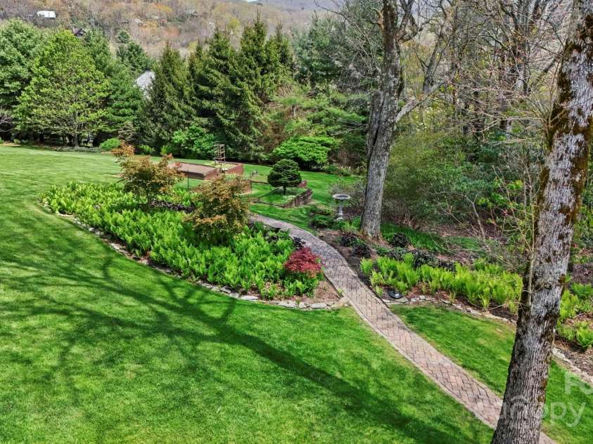 205 Indrio Road, Blowing Rock, NC 28605.  MLS# CAR4245602, YatesRealty ID 15556. Beautiful yards, walkways, gardens.
