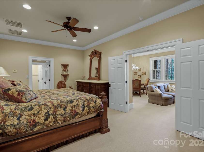 205 Indrio Road, Blowing Rock, NC 28605.  MLS# CAR4245602, YatesRealty ID 15556. One of the Bedroom Suites. This one on lower level shows view into Lower Living Room.