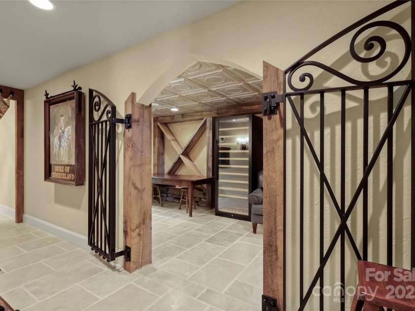 205 Indrio Road, Blowing Rock, NC 28605.  MLS# CAR4245602, YatesRealty ID 15556. Wine Cellar room - great for entertaining as it flows from living spaces to patio, to large hallway downstairs.