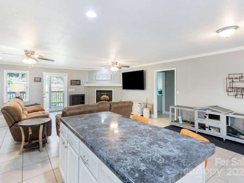 349 Penland Street, Clyde, NC 28721.  MLS# CAR4253328, YatesRealty ID 15558. Breakfast bar searing plus dining area
