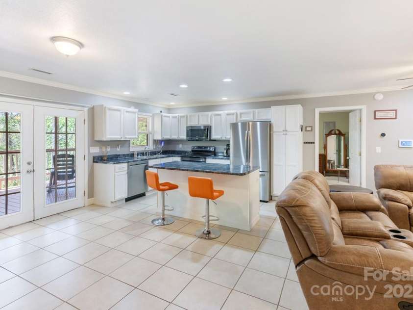 349 Penland Street, Clyde, NC 28721.  MLS# CAR4253328, YatesRealty ID 15558. Dining area into kitchen