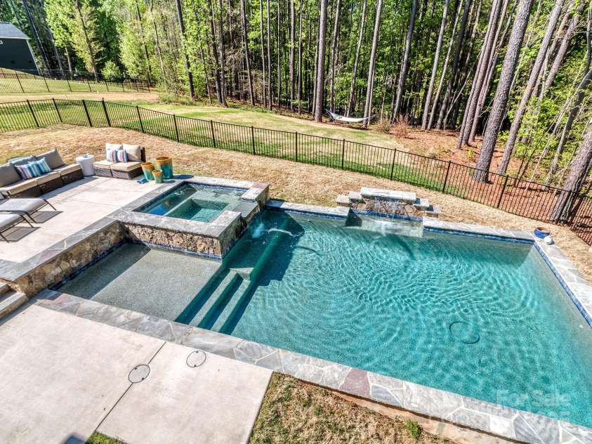 143 Robinson Ridge Drive, Mooresville, NC 28117.  MLS# CAR4246025, YatesRealty ID 15567. Beautiful Salt Water Pool & Hot Tub