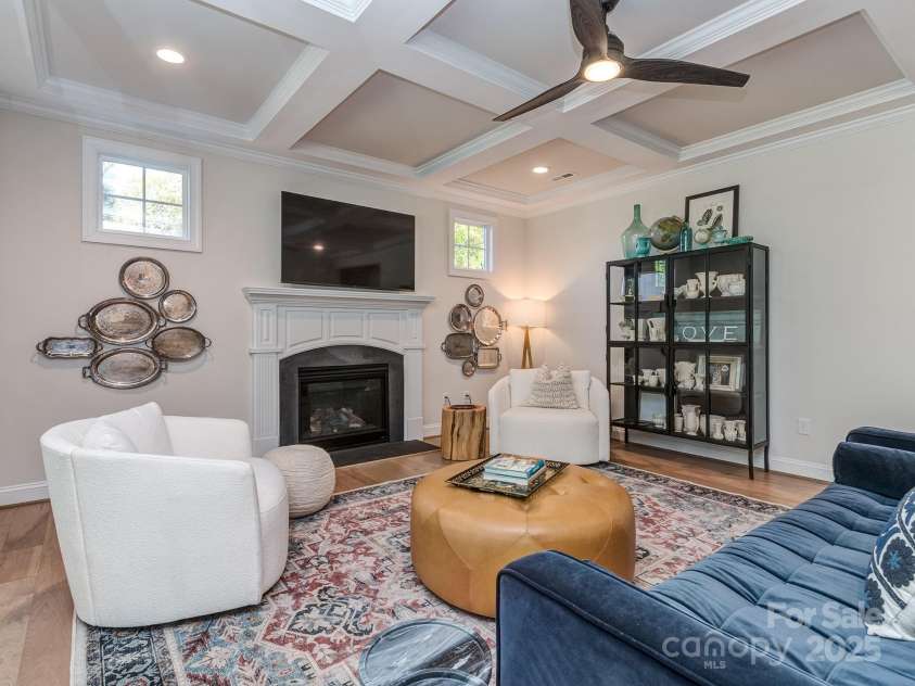 143 Robinson Ridge Drive, Mooresville, NC 28117.  MLS# CAR4246025, YatesRealty ID 15567. Living Room w/ Gas Fireplace and Coffered Ceilings