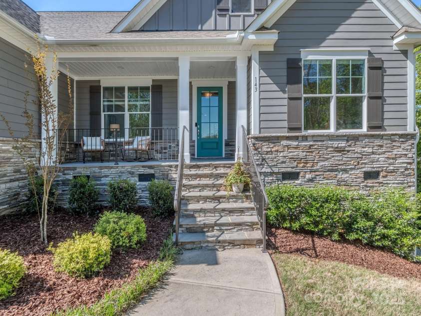 143 Robinson Ridge Drive, Mooresville, NC 28117.  MLS# CAR4246025, YatesRealty ID 15567. Rocking Chair Covered Front Porch
