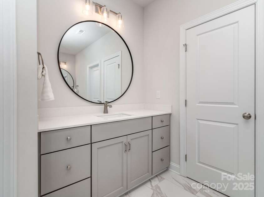143 Robinson Ridge Drive, Mooresville, NC 28117.  MLS# CAR4246025, YatesRealty ID 15567. Separate Vanities in Primary Bath