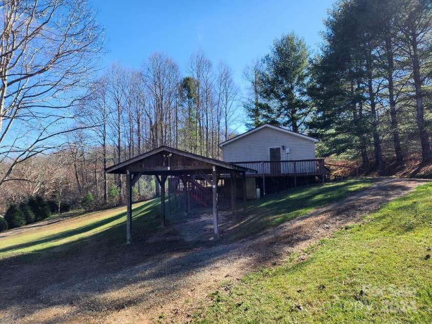 20 Coventry Lane, Burnsville, NC 28714.  MLS# CAR4199768, YatesRealty ID 1557. House and carport