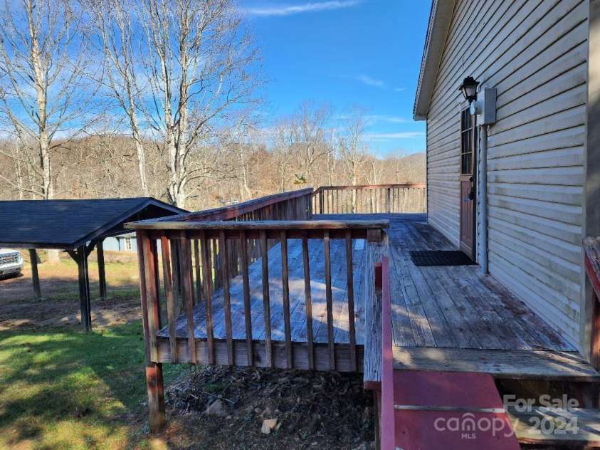 20 Coventry Lane, Burnsville, NC 28714.  MLS# CAR4199768, YatesRealty ID 1557. Looking northeast across the west end of the house