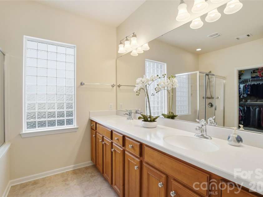 10469 Scotland Avenue, Fort Mill, SC 29707.  MLS# CAR4369452, YatesRealty ID 15570. Primary Bathroom on Main, dual vanity