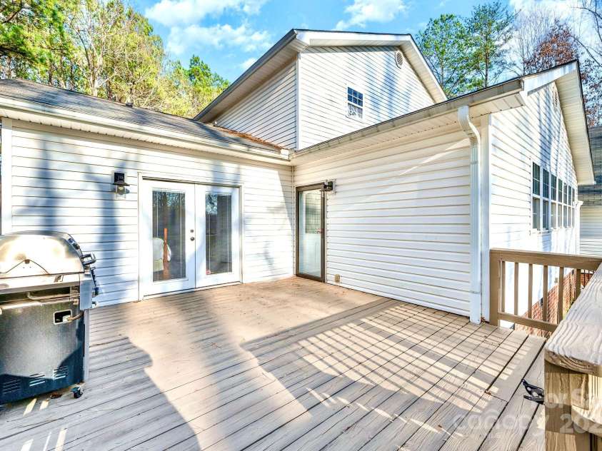8384 Blades Trail, Denver, NC 28037.  MLS# CAR4221160, YatesRealty ID 15575. Side deck off primary suite