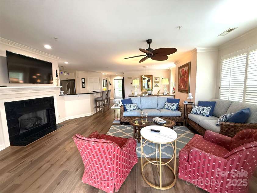 930 Jetton Street, Davidson, NC 28036.  MLS# CAR4309851, YatesRealty ID 15576. Plantation shutters throughout - Gas log fireplace.