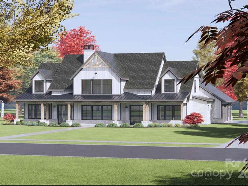 Lot 2 Country Estates Drive, Waxhaw, NC 28173.  MLS# CAR4276573, YatesRealty ID 1559. Proposed home features a steeply pitched, charcoal-colored architectural shingle roof adds character and dimension. The metal accent roofing over the porch enhances the farmhouse charm.