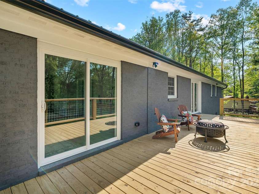 75 White Pine Drive, Fletcher, NC 28732.  MLS# CAR4251486, YatesRealty ID 15590. Back porch off main level