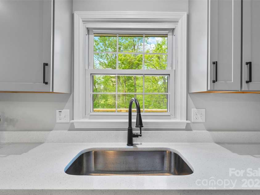75 White Pine Drive, Fletcher, NC 28732.  MLS# CAR4251486, YatesRealty ID 15590. Deep kitchen sink and stone countertops