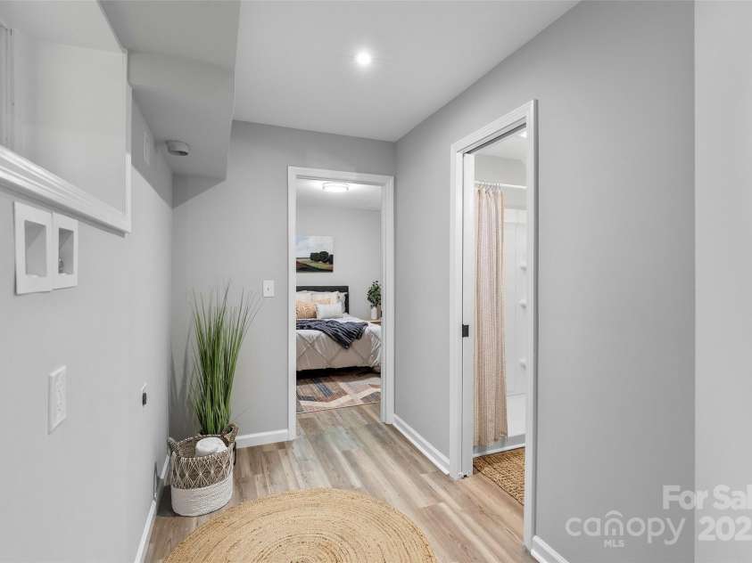 75 White Pine Drive, Fletcher, NC 28732.  MLS# CAR4251486, YatesRealty ID 15590. Downstairs hallway and laundry area