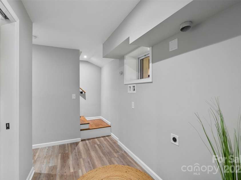 75 White Pine Drive, Fletcher, NC 28732.  MLS# CAR4251486, YatesRealty ID 15590. Downstairs hallway and laundry area