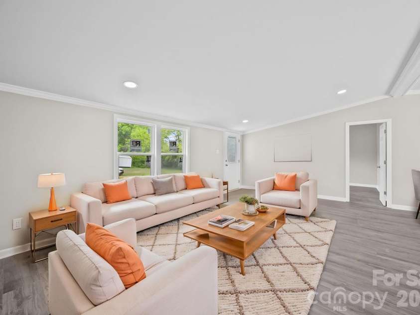 8592 Amanda Lane, Norwood, NC 28128.  MLS# CAR4368057, YatesRealty ID 15590. Virtually staged livingroom