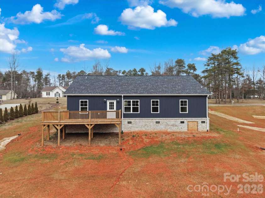 85 Cornerstone Drive, Taylorsville, NC 28681.  MLS# CAR4250711, YatesRealty ID 15599. Deck overlooking the spacious backyard