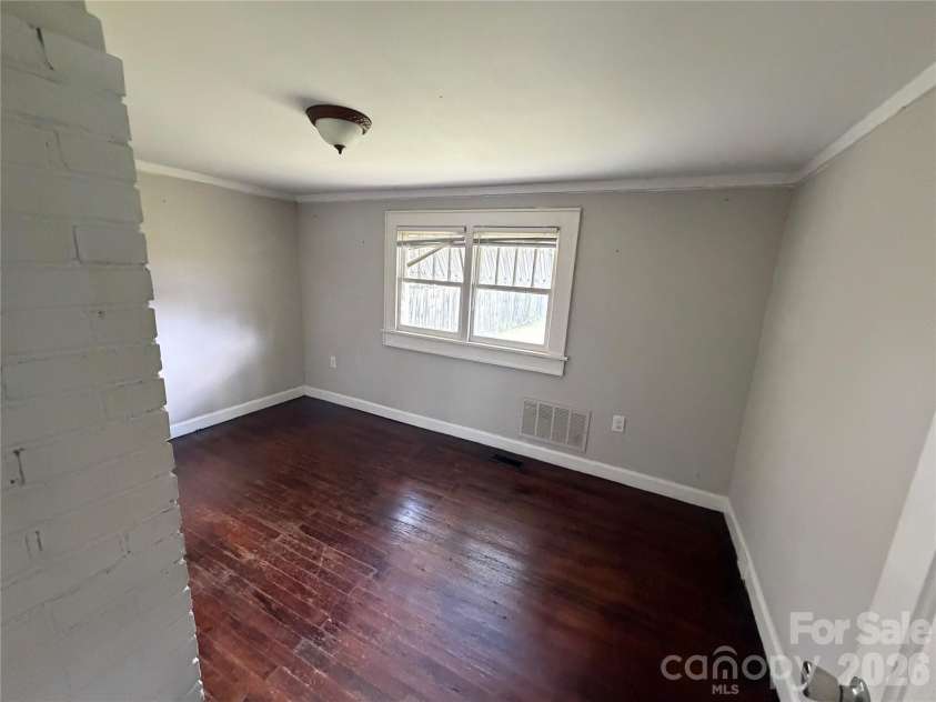 1002 Salisbury Avenue, Spencer, NC 28159.  MLS# CAR4365661, YatesRealty ID 15605. Front secondary bedroom