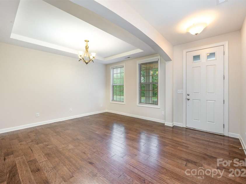 8268 Breton Way, Harrisburg, NC 28075.  MLS# CAR4255041, YatesRealty ID 15606. Formal dining with trey ceiling, rich wide plank hardwood floors. Wide entry way. Front door with glass inserts.