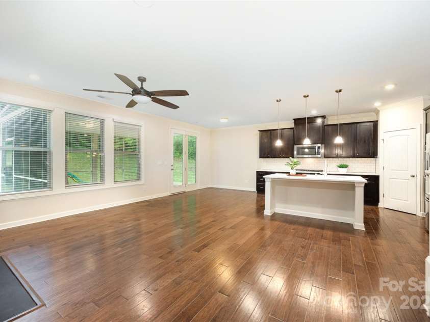 8268 Breton Way, Harrisburg, NC 28075.  MLS# CAR4255041, YatesRealty ID 15606. Lots of windows overlooking the screen porch.