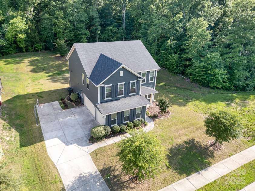 8268 Breton Way, Harrisburg, NC 28075.  MLS# CAR4255041, YatesRealty ID 15606. Side load three car bay on a private homesite!