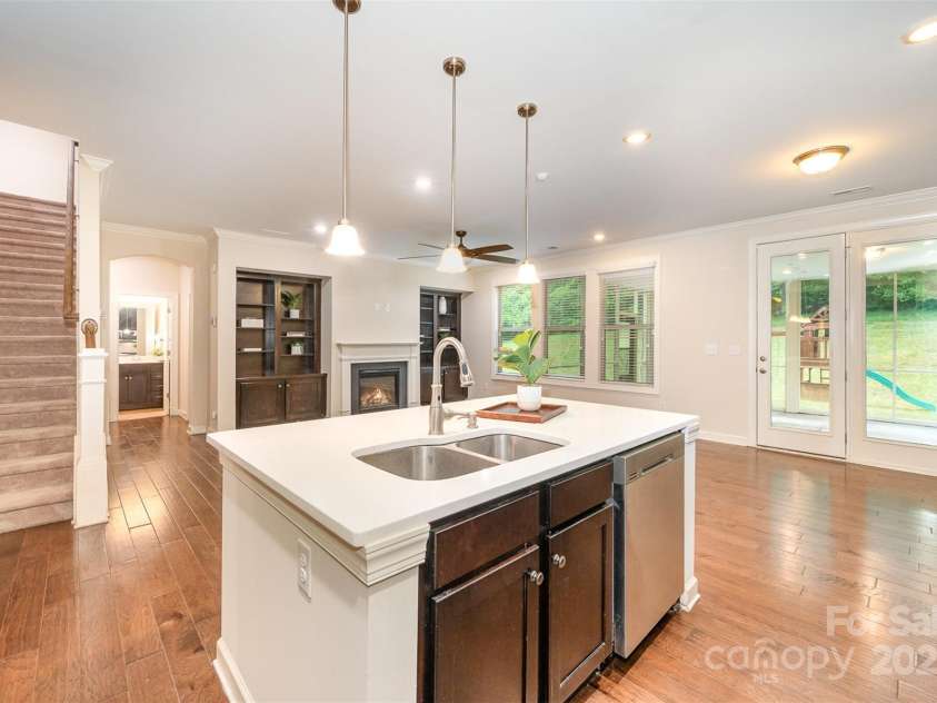 8268 Breton Way, Harrisburg, NC 28075.  MLS# CAR4255041, YatesRealty ID 15606. Spacious faminly room with fireplace. HDMI connection for mounting a tv.