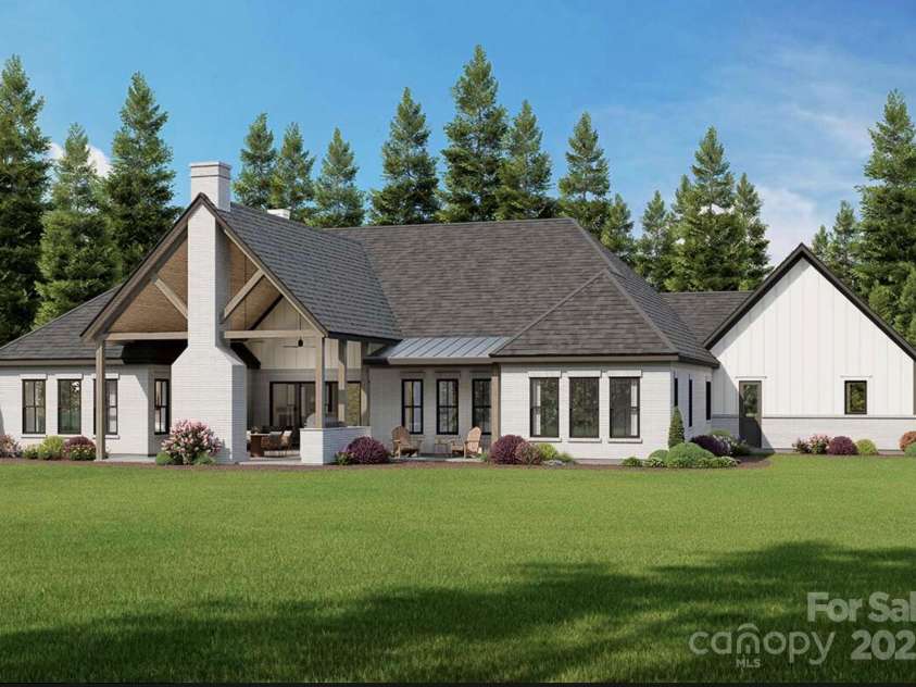 Lot 4 Country Estates Drive, Waxhaw, NC 28173.  MLS# CAR4278303, YatesRealty ID 1561. Spacious covered patio with exposed timber trusses and a brick fireplace, perfect for outdoor living and entertaining. 