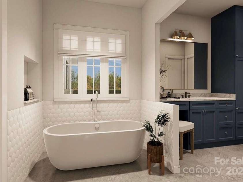 Lot 4 Country Estates Drive, Waxhaw, NC 28173.  MLS# CAR4278303, YatesRealty ID 1561. This luxurious bathroom features a deep soaking tub beneath a wide window with soft Roman shades, offering natural light and privacy. 