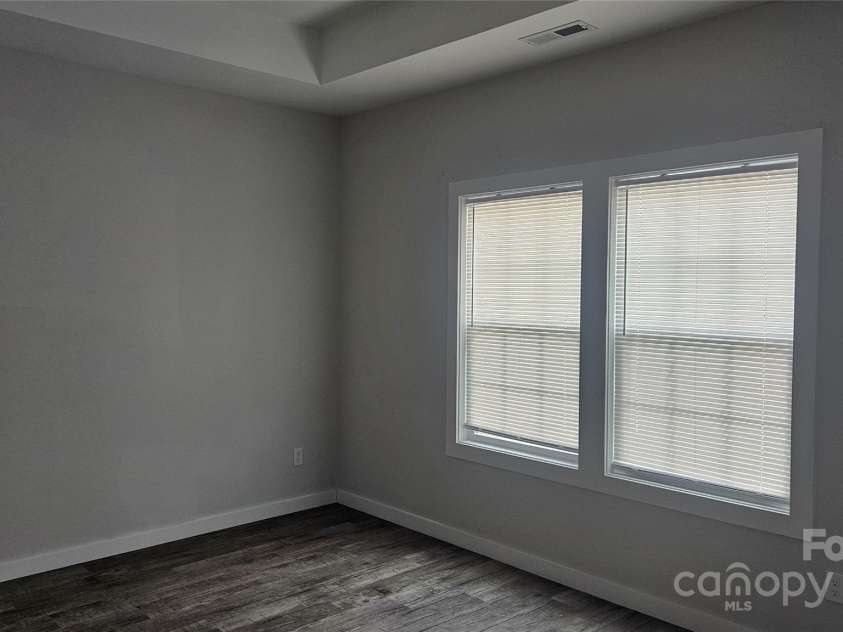 1124 Clouse Street, Gastonia, NC 28052.  MLS# CAR4239455, YatesRealty ID 15614. Primary bedroom with trey ceiling and ceiling fan