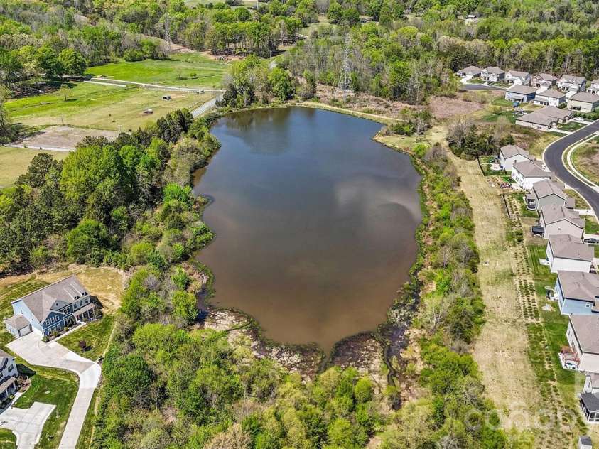 514 Tack Lane, Midland, NC 28107.  MLS# CAR4358317, YatesRealty ID 15618. Cedarvale Farm Pond