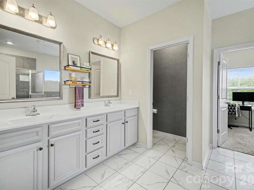514 Tack Lane, Midland, NC 28107.  MLS# CAR4358317, YatesRealty ID 15618. Primary Bathroom with water closet