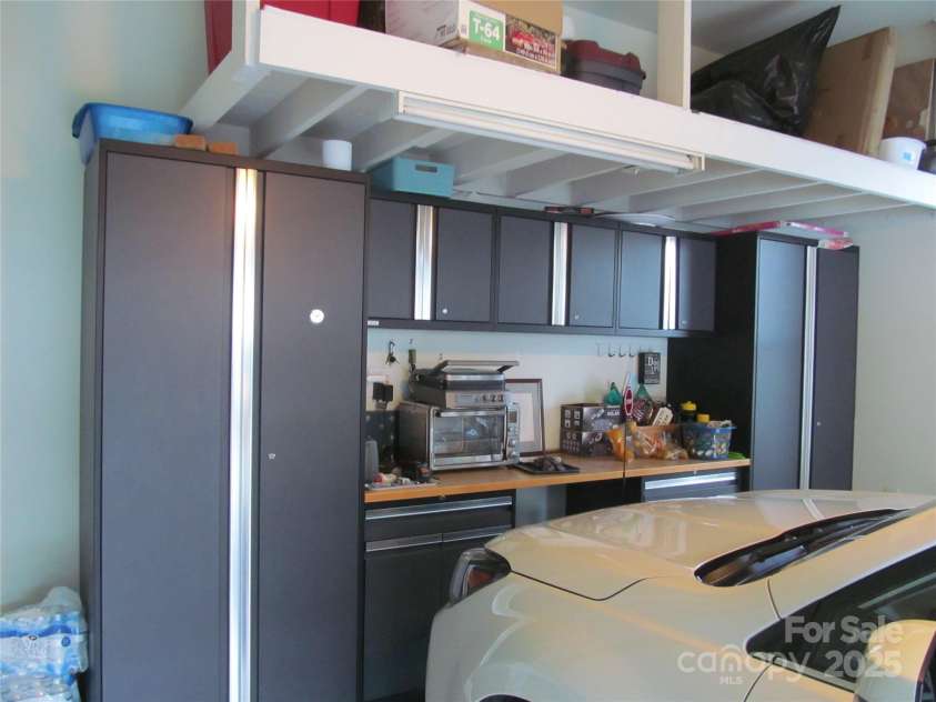 1601 Eden Glen Drive, Dallas, NC 28034.  MLS# CAR4211731, YatesRealty ID 15625. Garage with nice shelving / work space