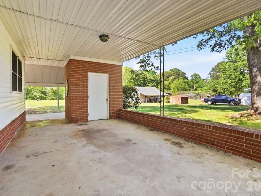 2531 Arnold Drive, Monroe, NC 28110.  MLS# CAR4369421, YatesRealty ID 15626. Large Carport