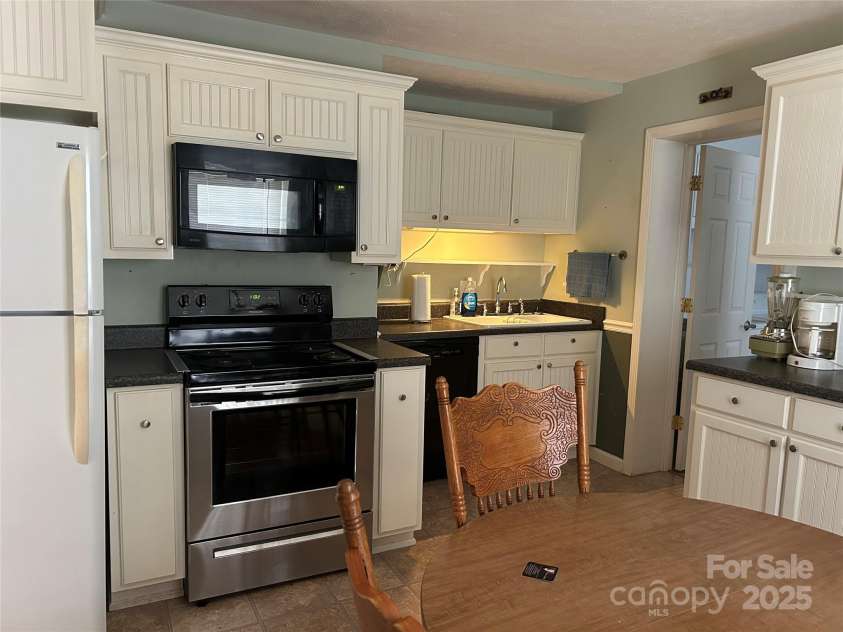 617 Reservoir Road, Marion, NC 28752.  MLS# CAR4257256, YatesRealty ID 15627. Refrigerator, Range, Sink