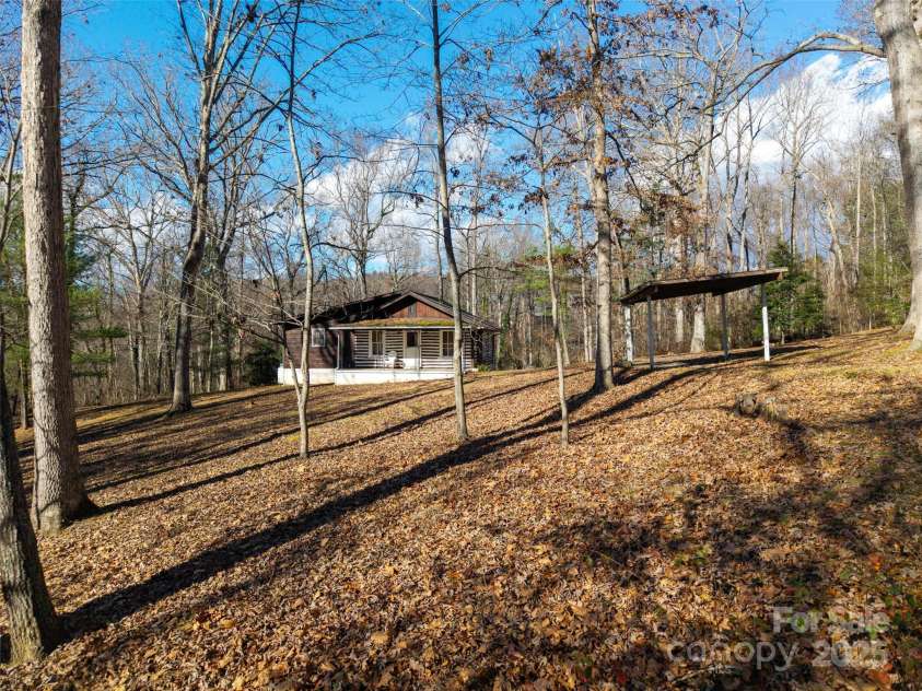 67 Shawnee Trail, Asheville, NC 28805.  MLS# CAR4331437, YatesRealty ID 1563. Cabin, Storage, and Carport